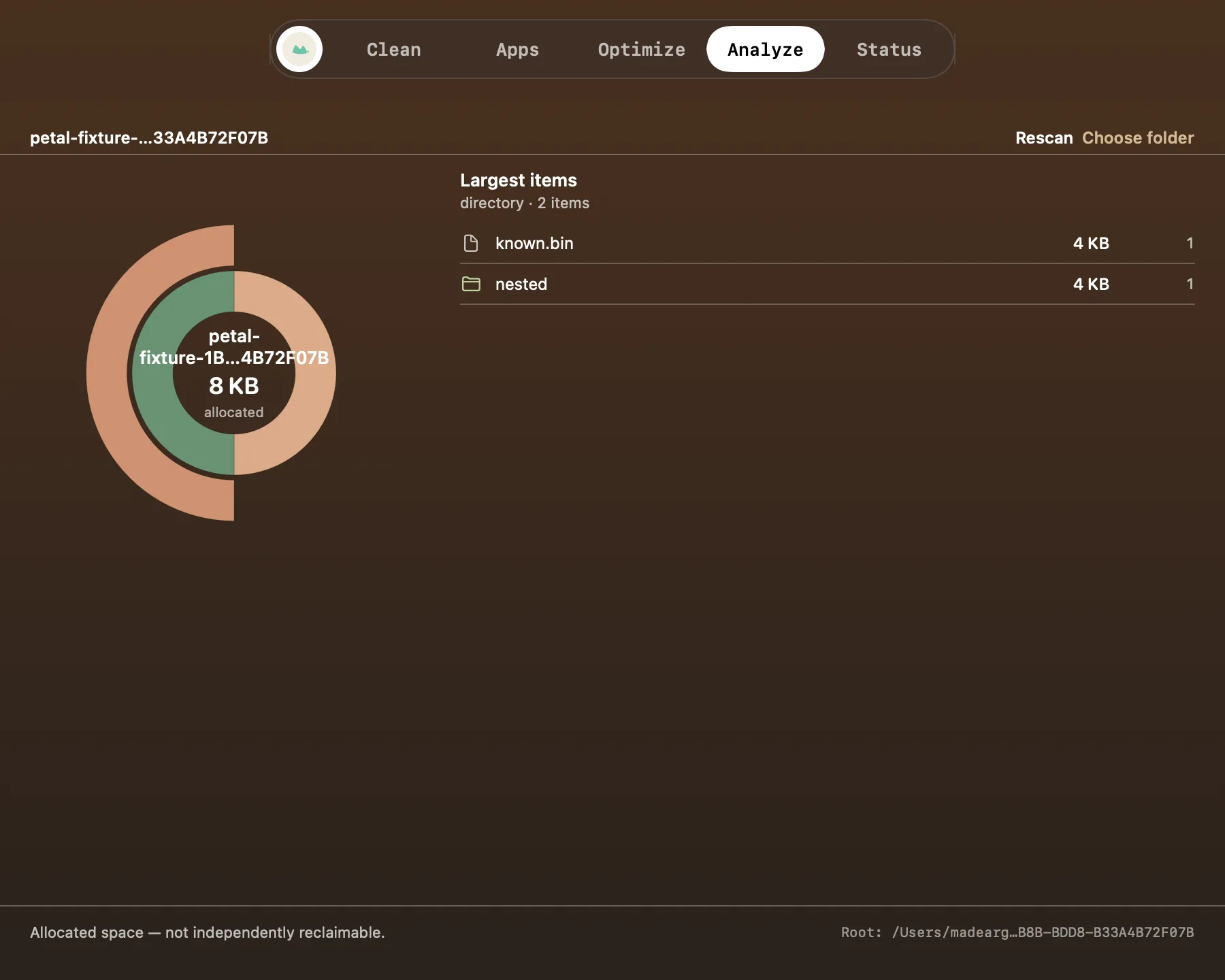 Nusa Analyze page: the sunburst disk explorer mid-scan with folder list and findings.
